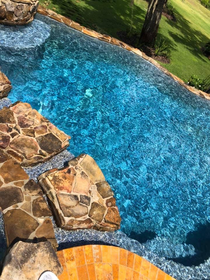 Custom pool with natural stone - pool we maintain